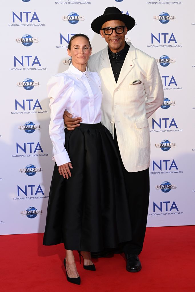 Jay Blades in a white jacket and wife Lisa in a shirt on the red carpet