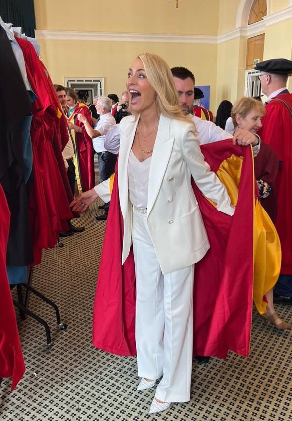 Tess Daly getting put into graduation robes