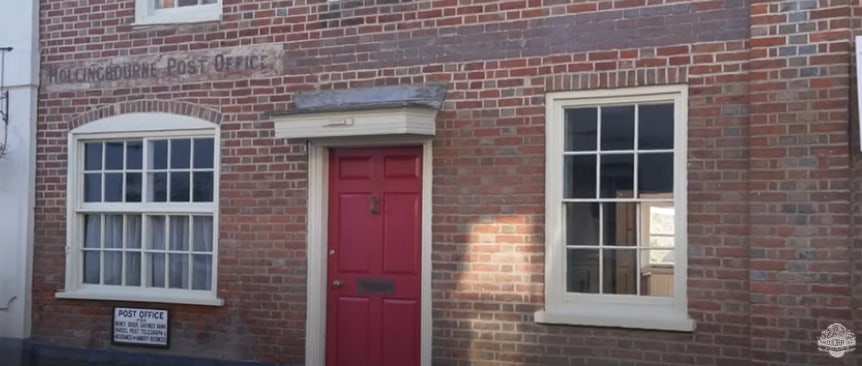red brick house with red door