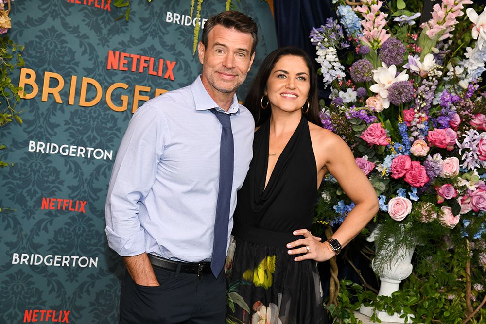 Scott Foley poses with actress wife Marika Domińczyk at a Bridgerton event