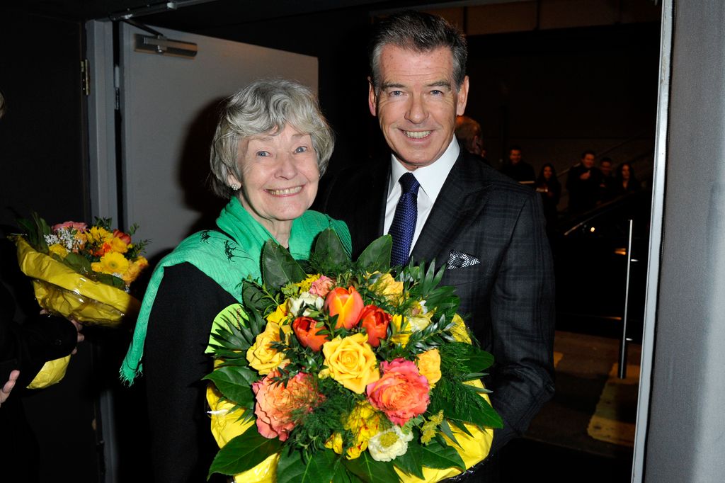 Pierce Brosnan (R) and his mother Mary Carmichael (L) pose after the Zurich Premiere of 'A Long way down' at Kino Corso on February 11, 2014 in Zurich, Switzerland.