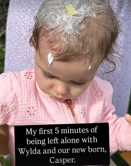 A young girl with yoghurt in her hair
