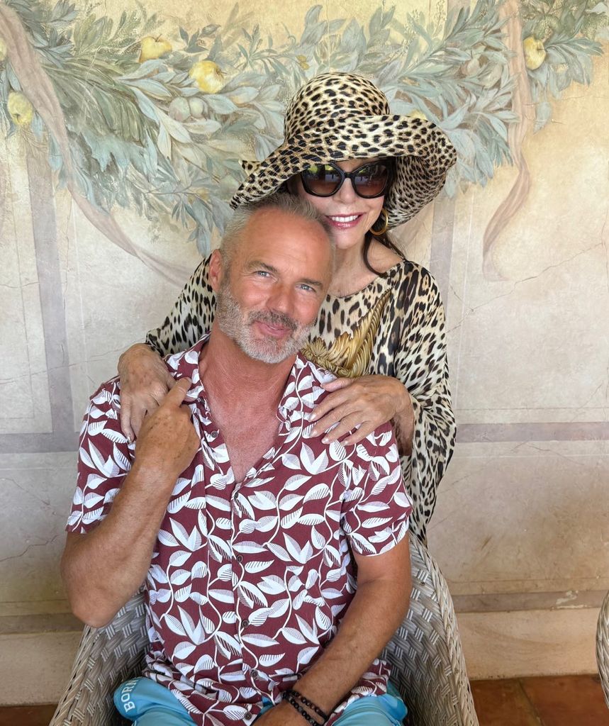 health joan collins in leopard print outfit and hat