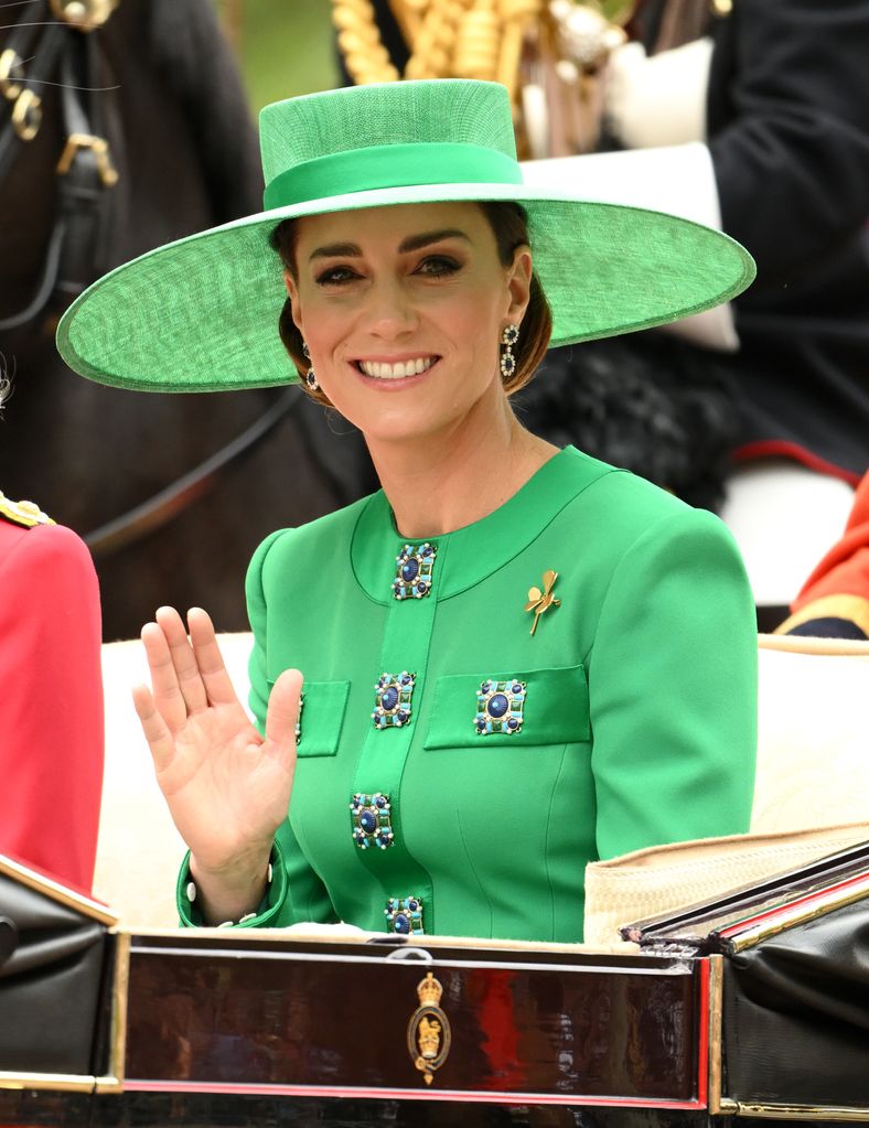 Kate Middleton waving from the horse-drawn carriage