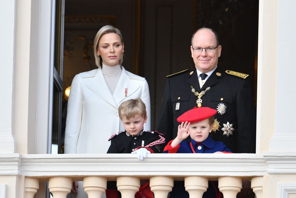 Prince Jacques and Princess Gabriella of Monaco waving on balcony  