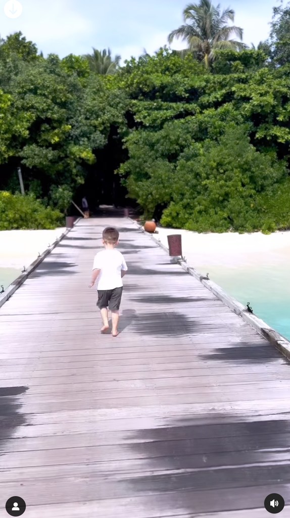 young boy running along pontoon