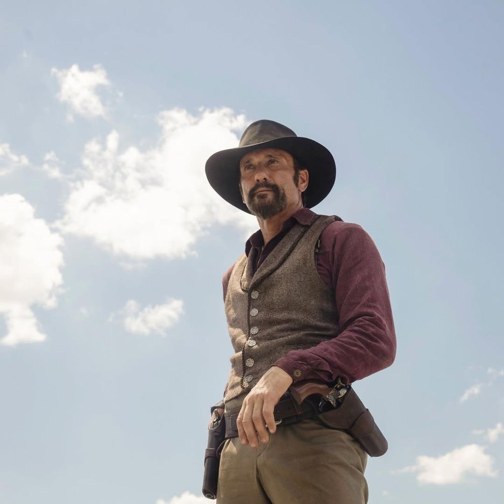 A man wearing a cowboy hat