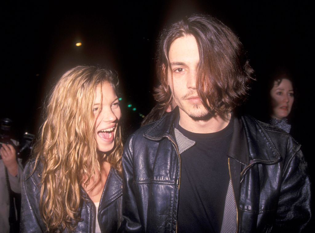 Kate Moss smiling at Johnny Depp