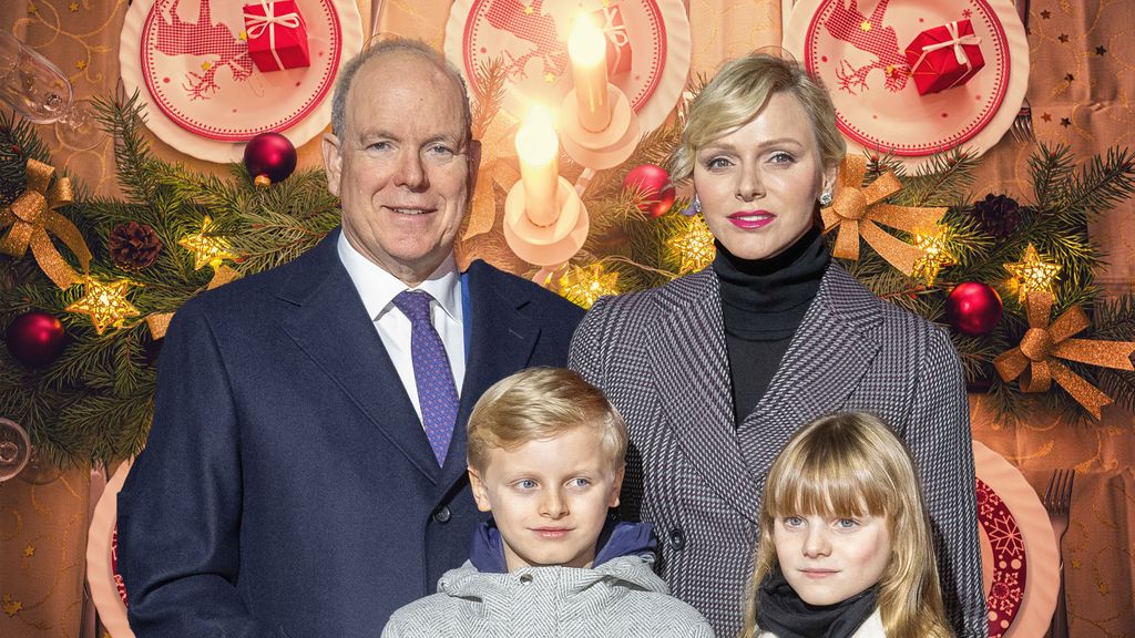 Princess Charlene and albert with twins Prince Jacques and Princess Gabriella with christmas table backdrop