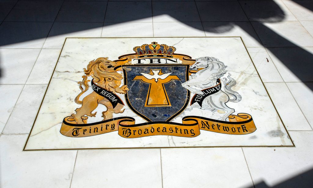 A coat of arms in the floor of the lobby of the former Trinity Broadcasting Network building located on Bear Street and the 405 freeway in Costa Mesa, across the freeway from South Coast Plaza, on Wednesday, September 11, 2019. "nThe property and building has been acquired by EF Education First, a global education company focusing on language, academic, cultural exchange, and educational travel programs