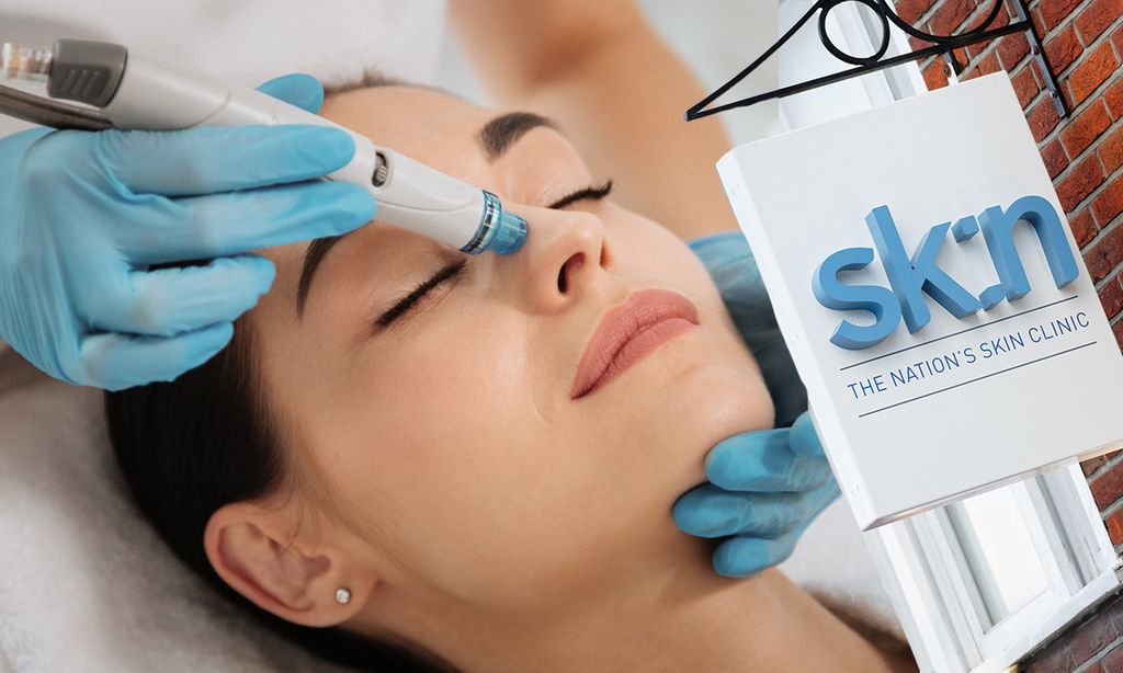 Woman receiving skincare treatment at sk:n clinics