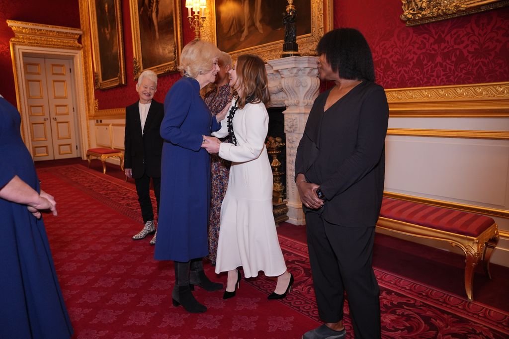 Queen Camilla greets Royal Commonwealth Society Ambassador Geri Halliwell-Horner, during a reception to celebrate the winners of the Queen's Commonwealth Essay Competition at St James's Palace on November 20, 2025 in London, England.