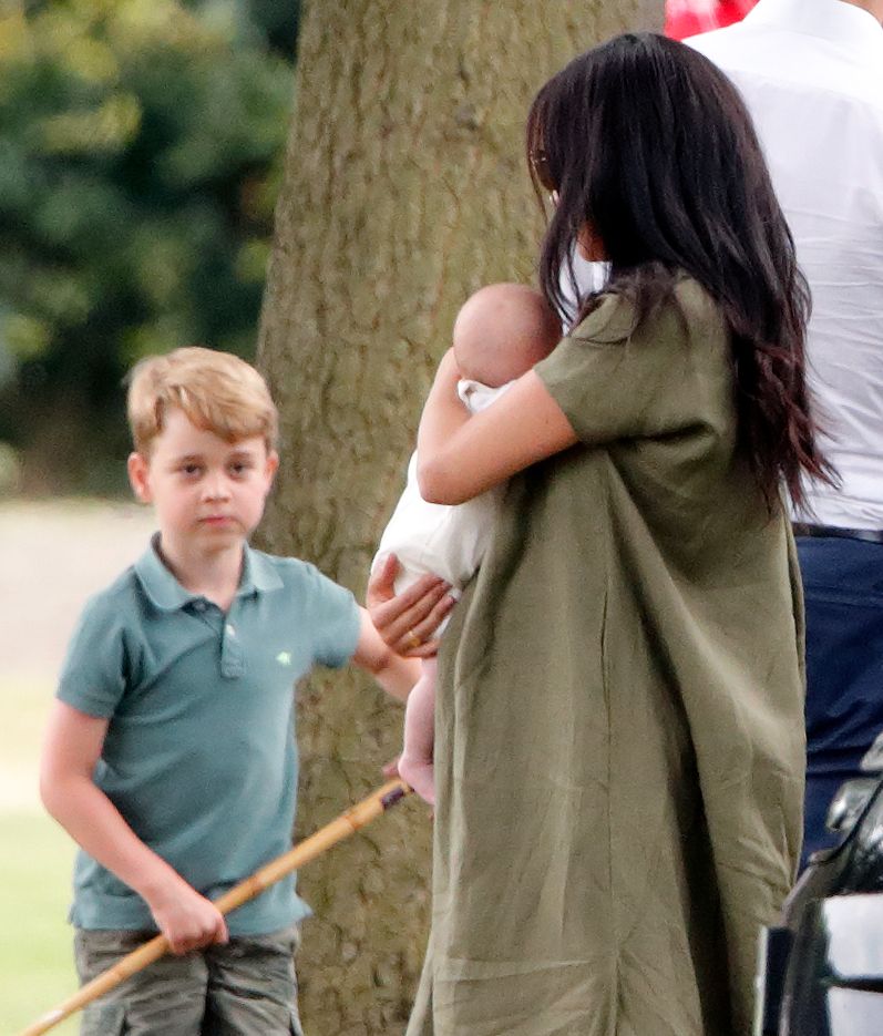 Prince George was seen chatting to aunt Meghan and cousin Archie