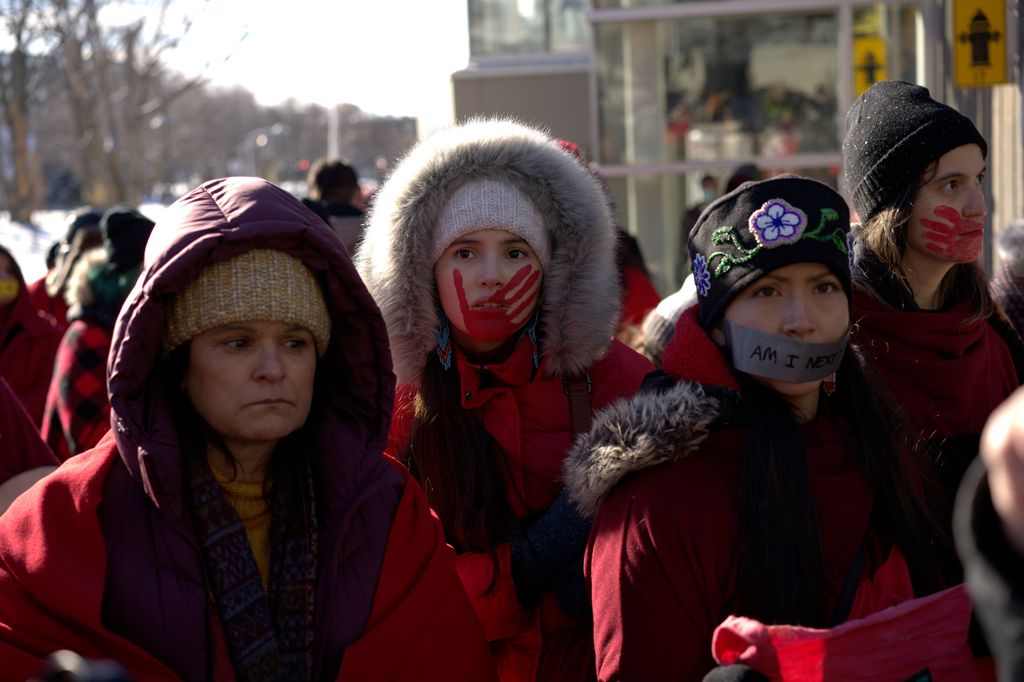 Georgia Lightning in a protest in a scene from Three Pines