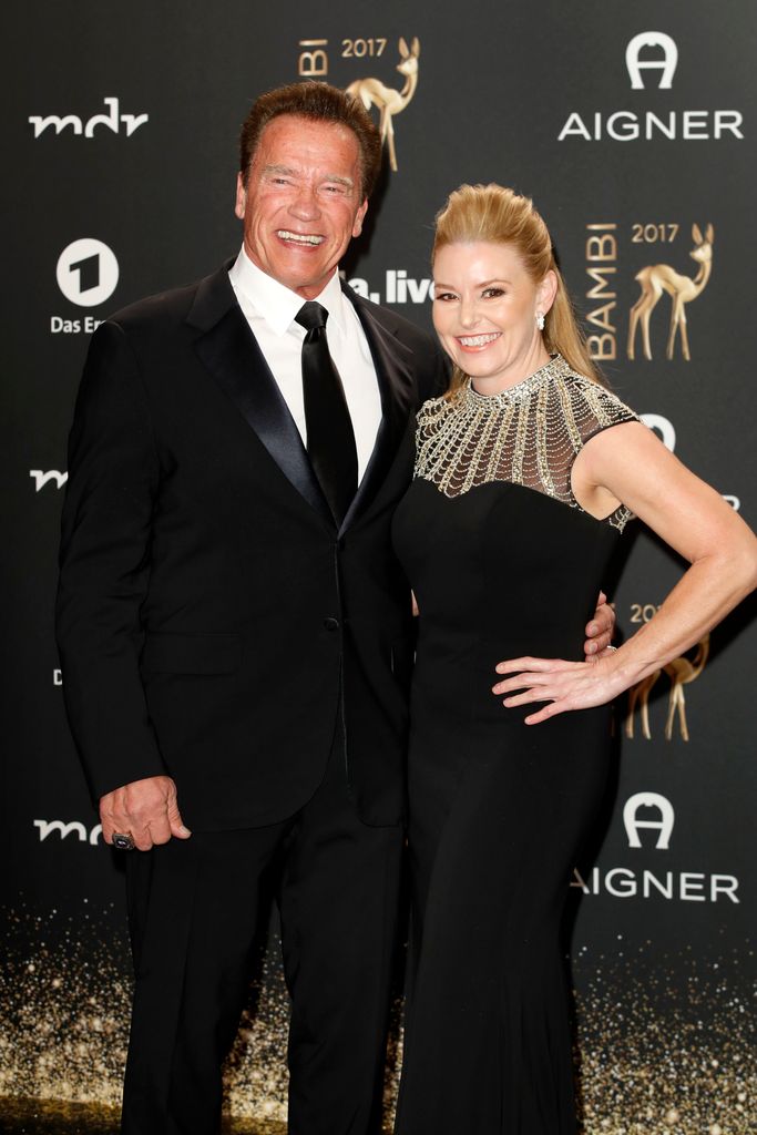 Arnold Schwarzenegger and his partner Heather Milligan arrive at the Bambi Awards 2017 at Stage Theater on November 16, 2017 in Berlin, Germany
