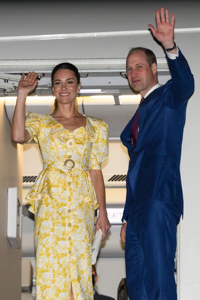 Princess Kate and Prince William wave as they enter a plane