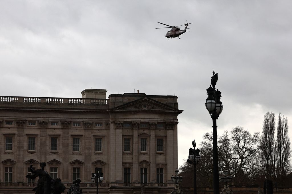 A helicopter is pictured as it prepares to land in the grounds of Buckingham Palace