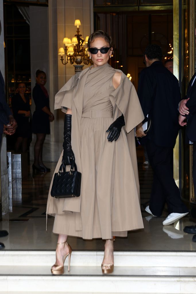 A pair of leather gloves and a Lady Dior bag complemented the Dior ensemble
