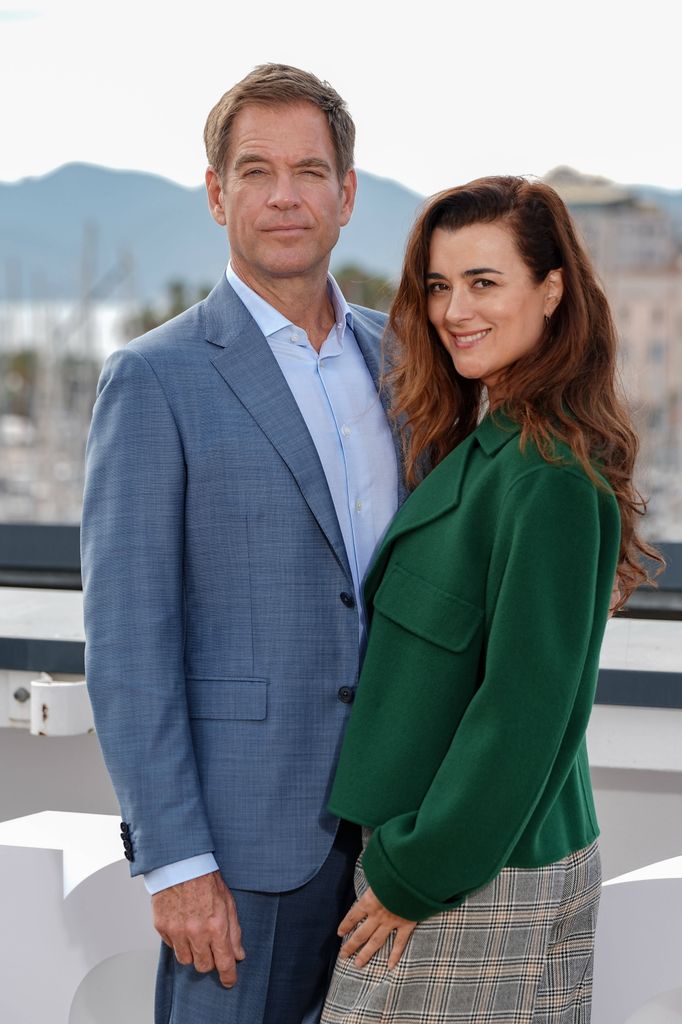 Man and woman posing for photo call