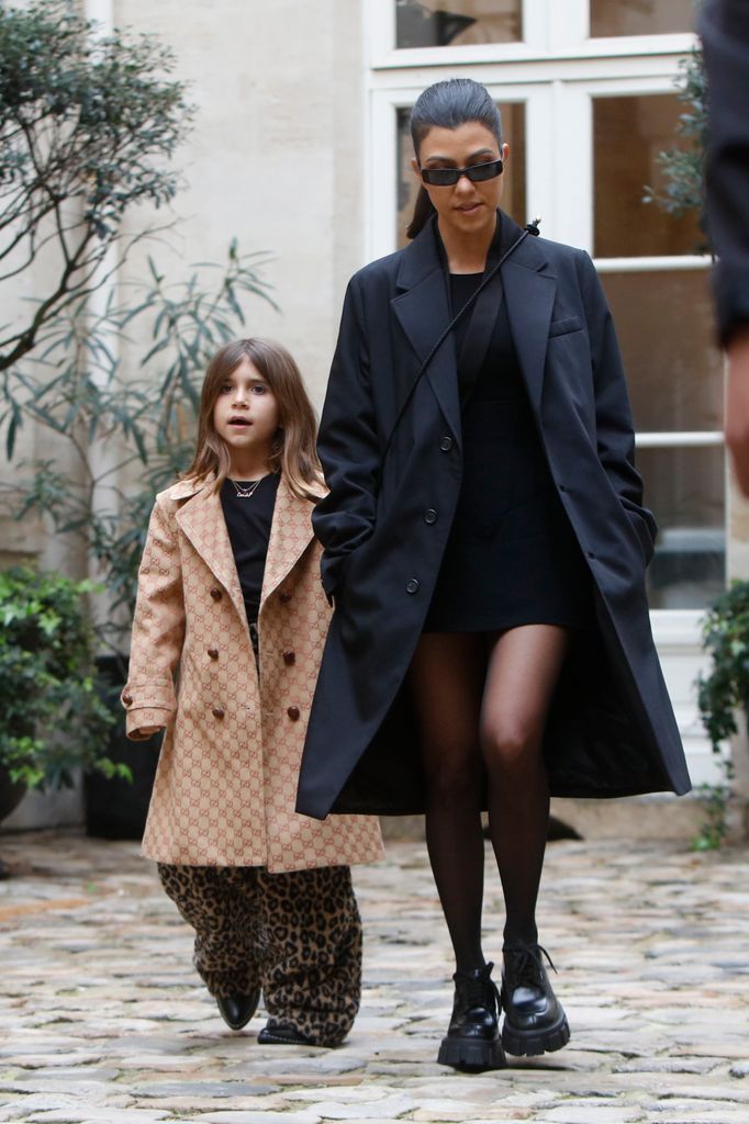 Kourtney Kardashian and her daughter Penelope Disick pictured at the Cafe de Flore in Paris 