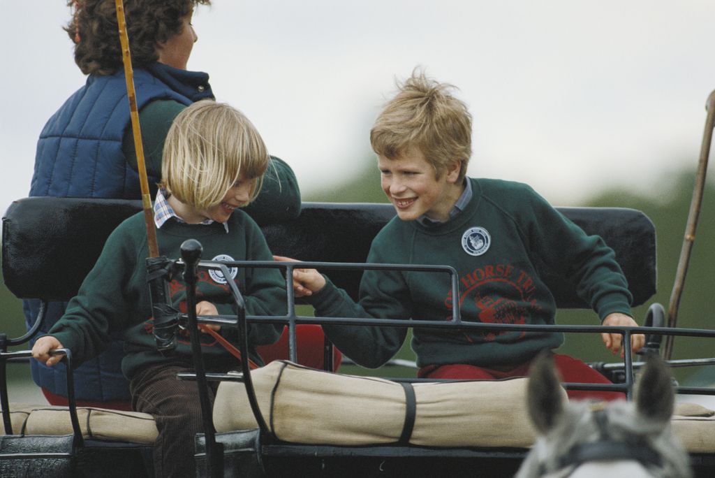 Zara Phillips and her brother Peter Phillips riding a carriage at the Royal Windsor Horse Show in 1992