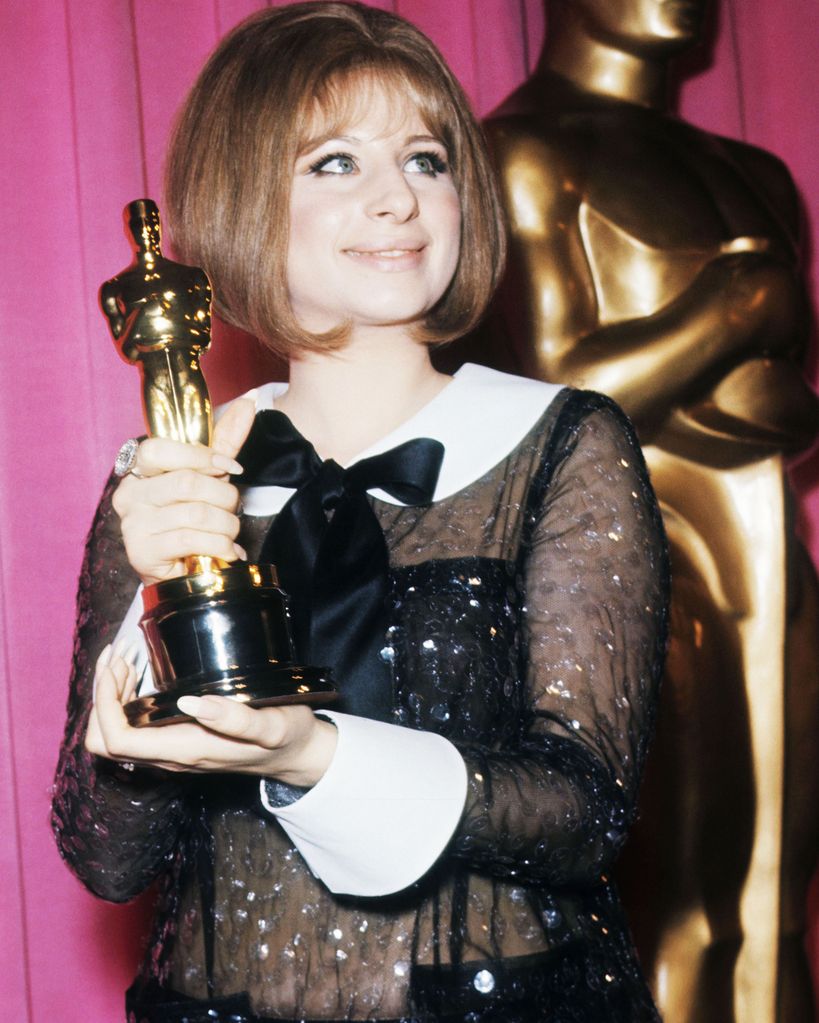 Singer and actress Barbra Streisand holds her Oscar for Best Actress won for the performance as Fanny Brice in the musical comedy-drama movie Funny Girl, 14th April 1969. The year was notable for the first, and, so far, only, tie for Best Actress as actress Katharine Hepburn and Barbra Streisand shared the award.
