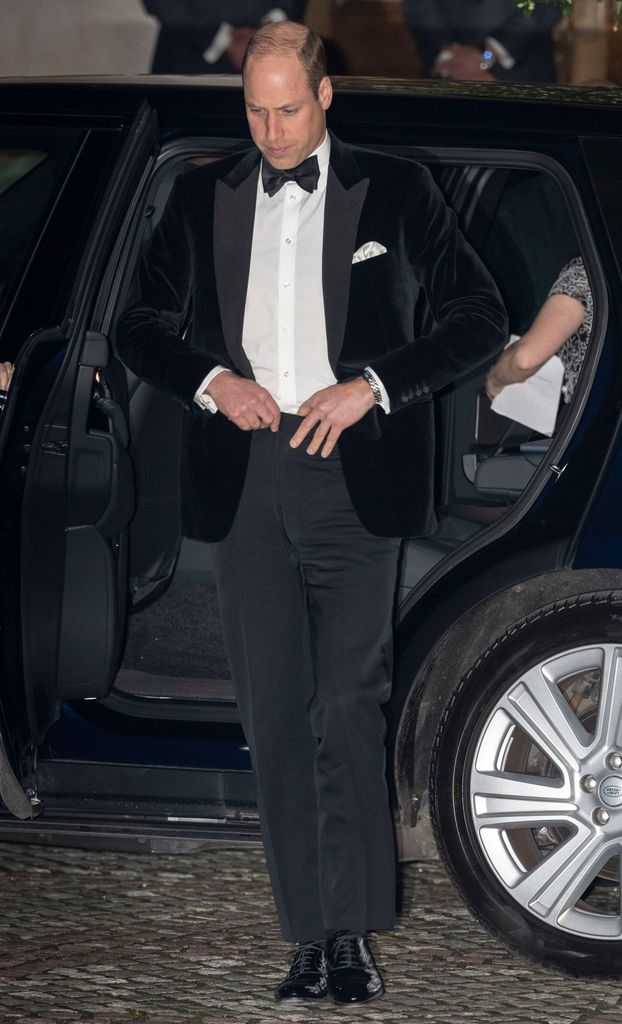 Prince William adjusting jacket as he arrives at London's Air Ambulance Charity Gala Dinner 