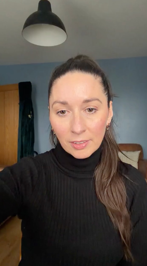 woman in black jumper in lounge