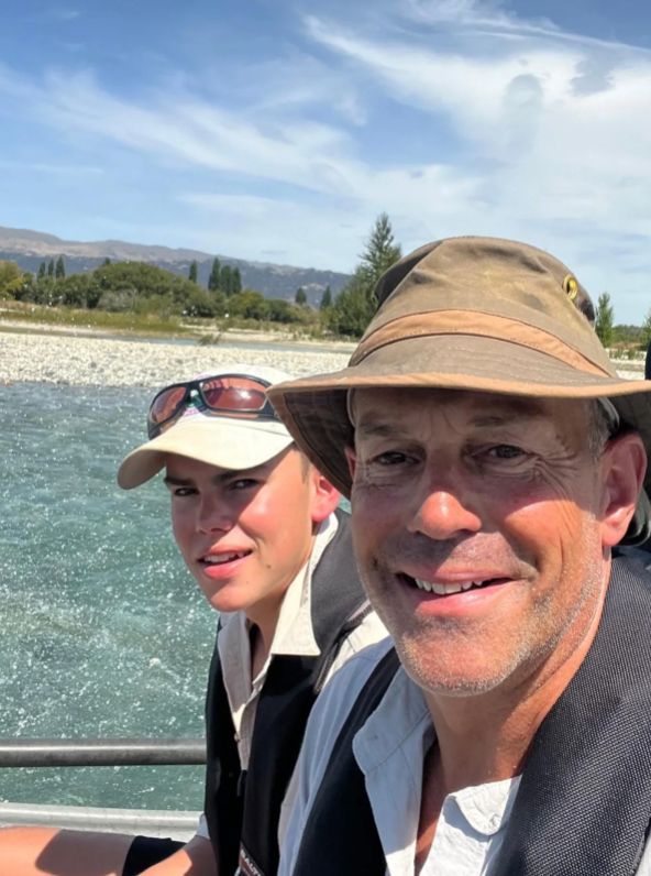 Phil Spencer and his son fishing together