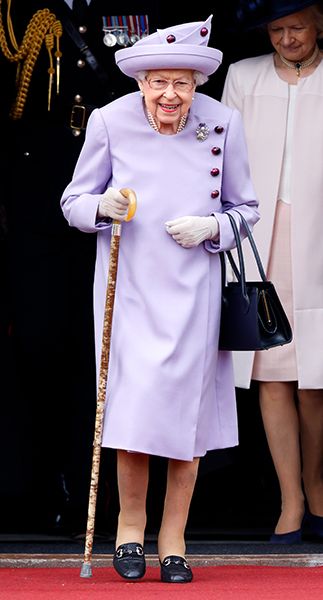the queen with walking stick