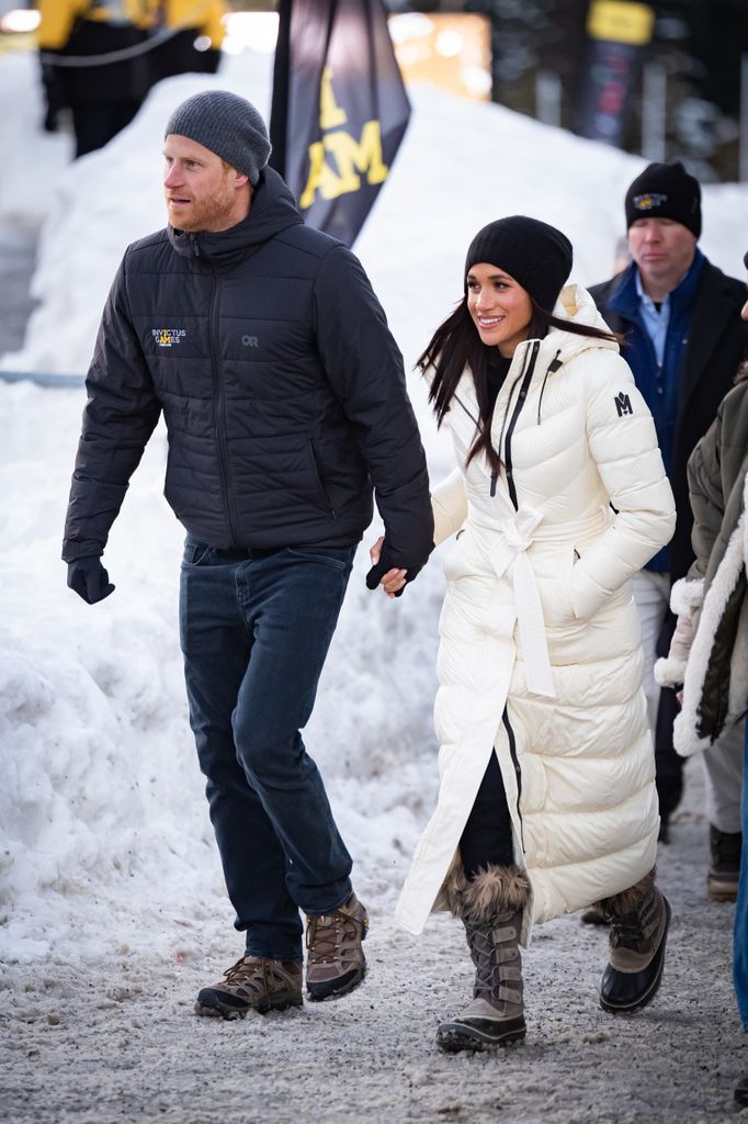 two people walking through snow