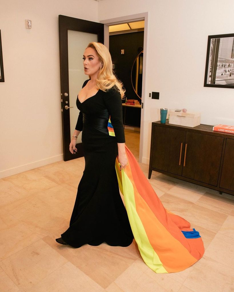 Adele shows her support for Pride by wearing a rainbow cape