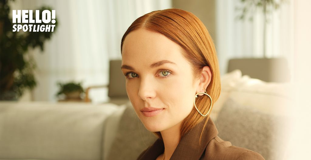 Morgan Kohan sits on a sofa