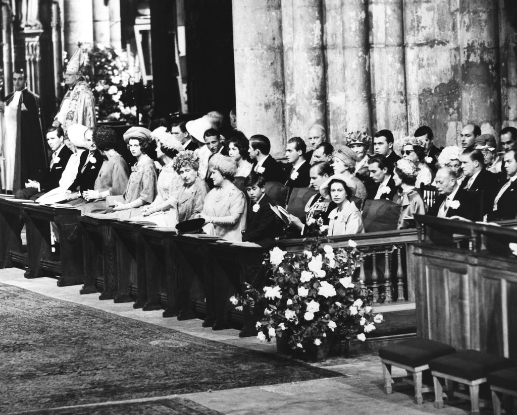 Members of the royal family sitting in cathedral pews