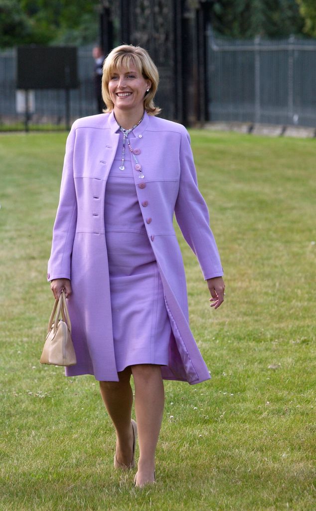 Pregnant Duchess Sophie in pink dress and coat on grass