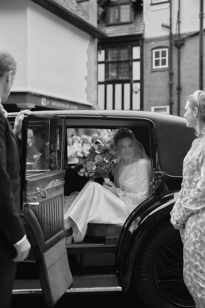 olivia henson getting out of her wedding car