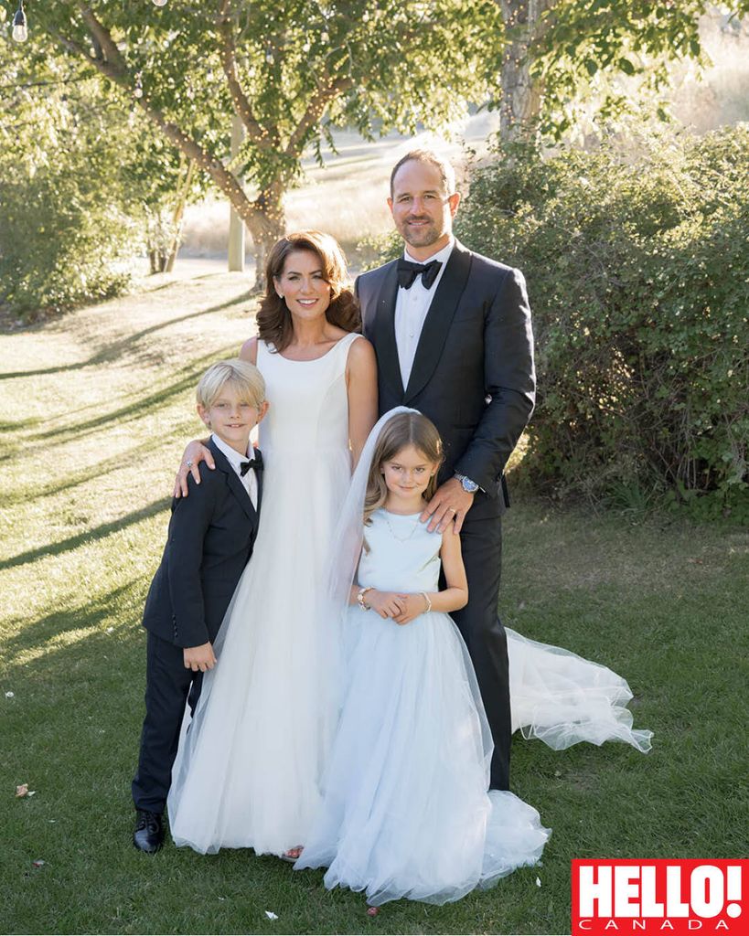 The bride and groom pose with their children Leo and Annie. It was the perfect day for everyone!