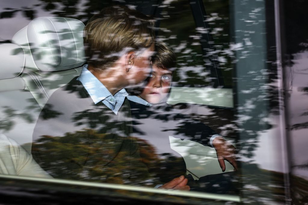 Prince Louis of Wales and Prince George in back of car