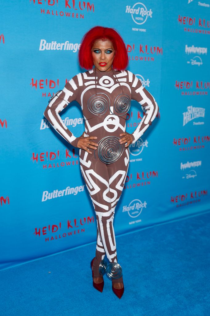 Tamron Hall dressed as a Keith Haring Painting on model Grace Jones at Heidi Klum's 24th Annual Halloween Party 