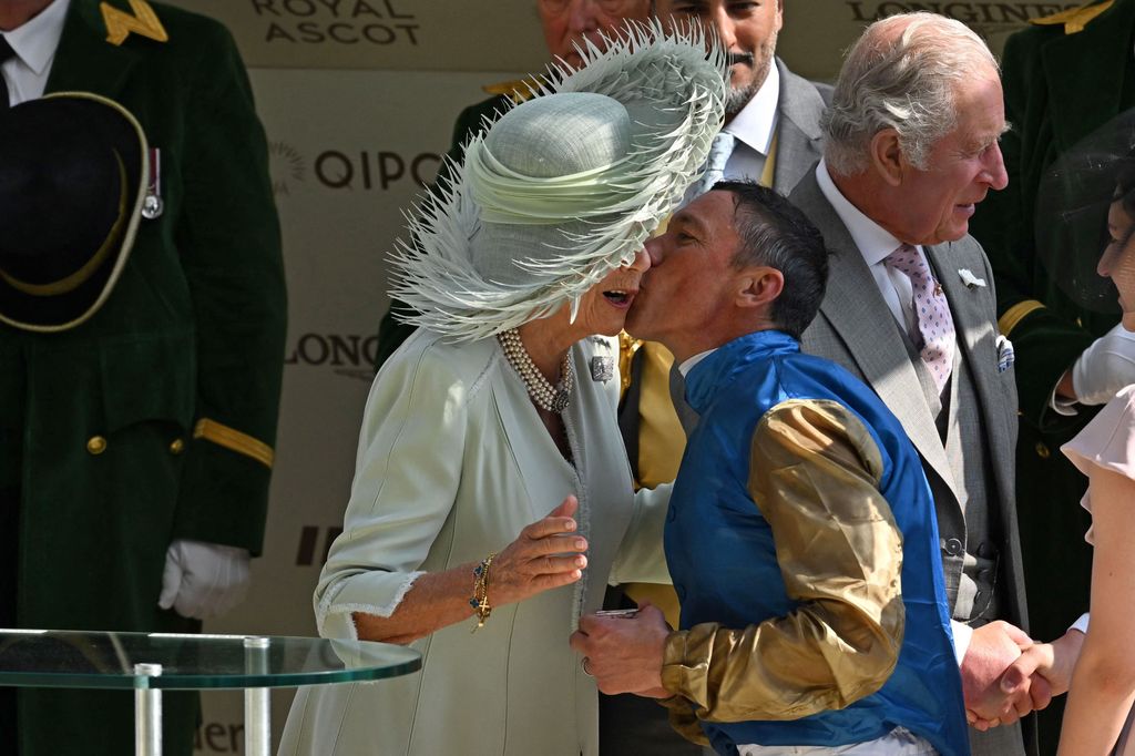Frankie Dettori kisses Queen Camilla