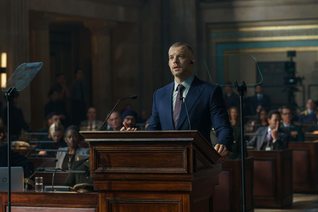 man standing behind podium in court