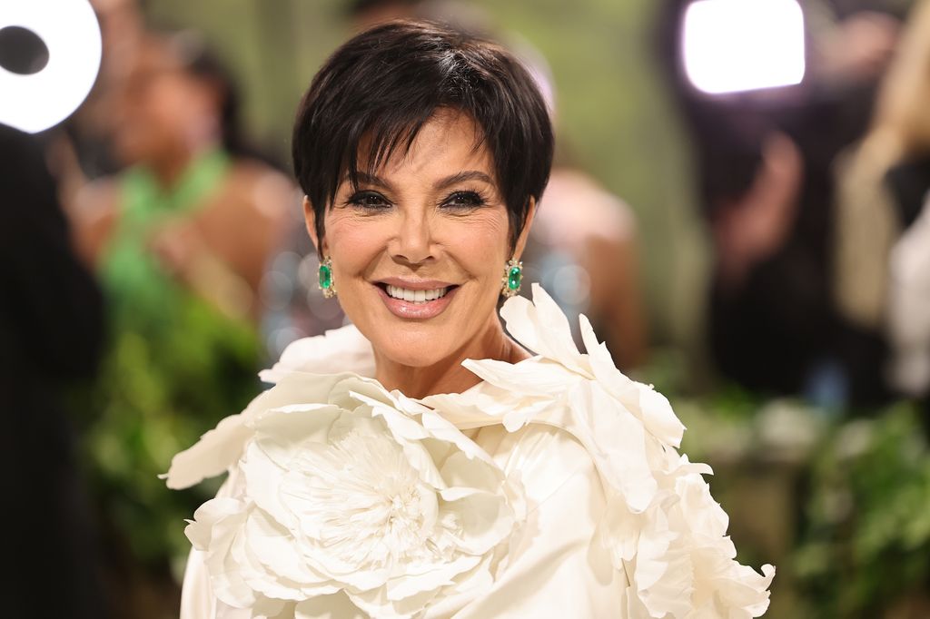 Kris Jenner at the Met Gala in 2024 smiling in white