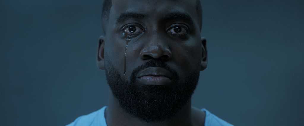 Shamier Anderson with a tear running down his cheek in Invasion