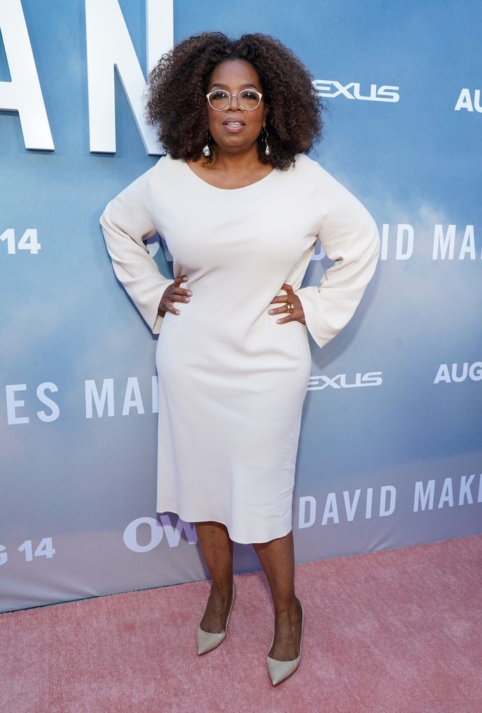oprah winfrey white dress posing red carpet 