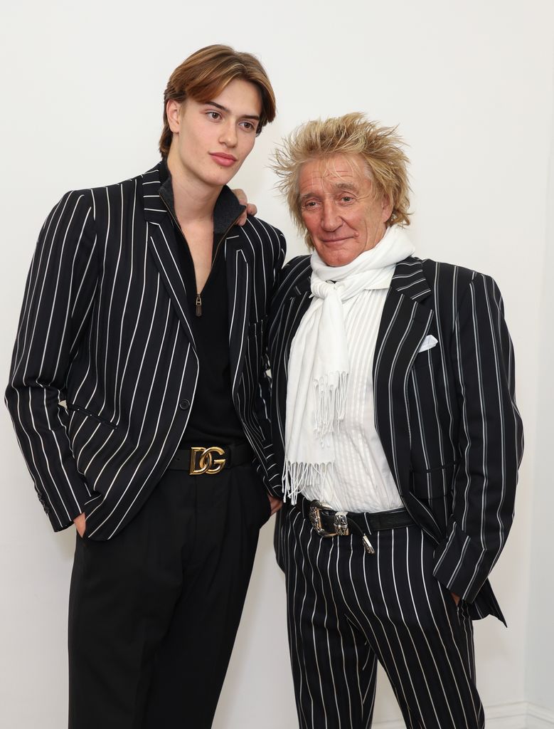 Rod Stewart's model son Alastair towers above him in matching