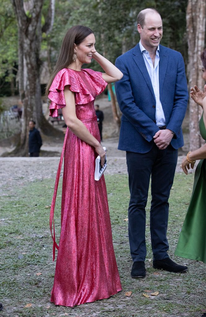 Kate side on in pink dress beside prince william