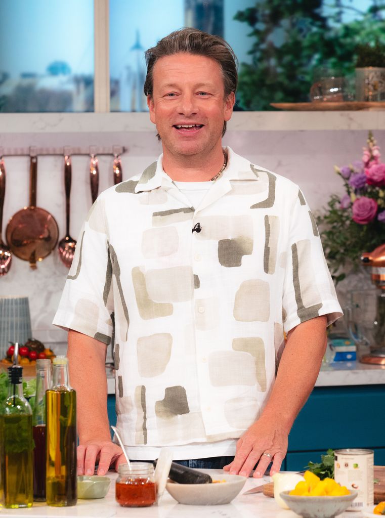 Jamie Oliver in This Morning kitchen in printed white and beige shirt