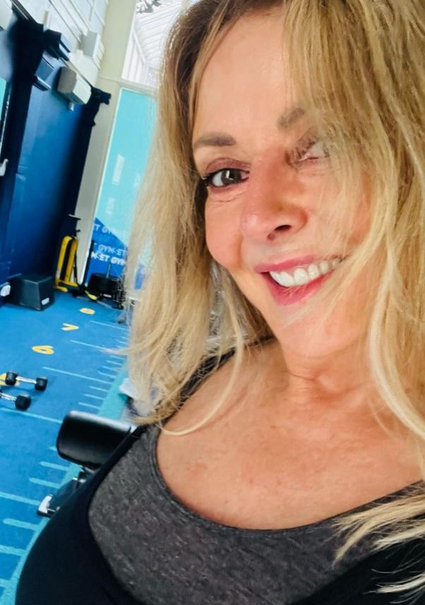 Carol Vorderman in the gym in black and grey outfit