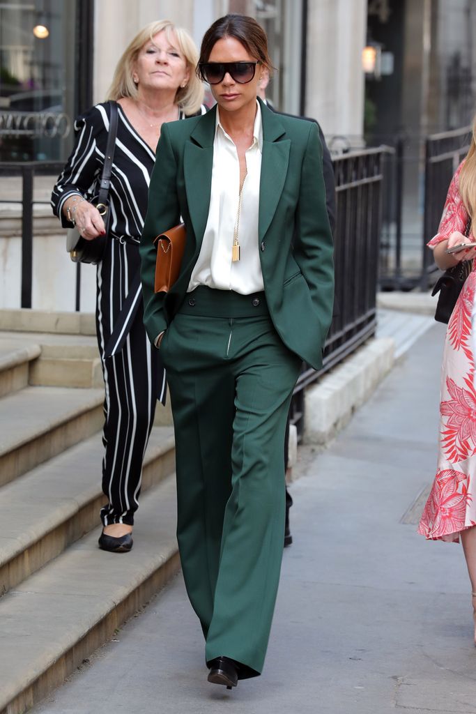 Victoria Beckham leaving her London store on in 2018 in the OG necklace, before it was transformed into a fragrance bottle