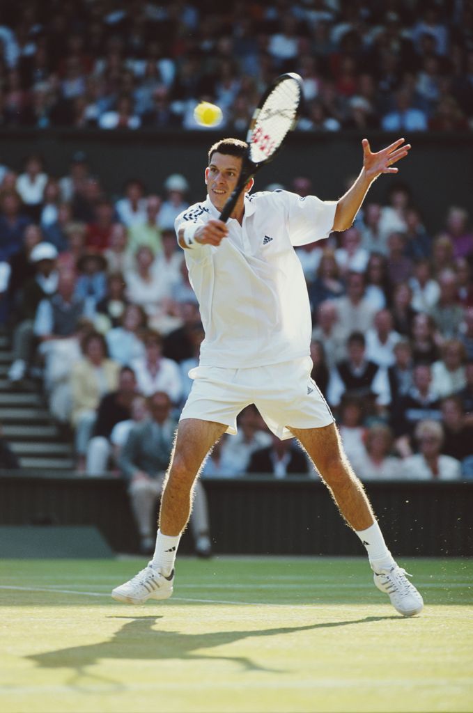 Tim henman hitting tennis ball